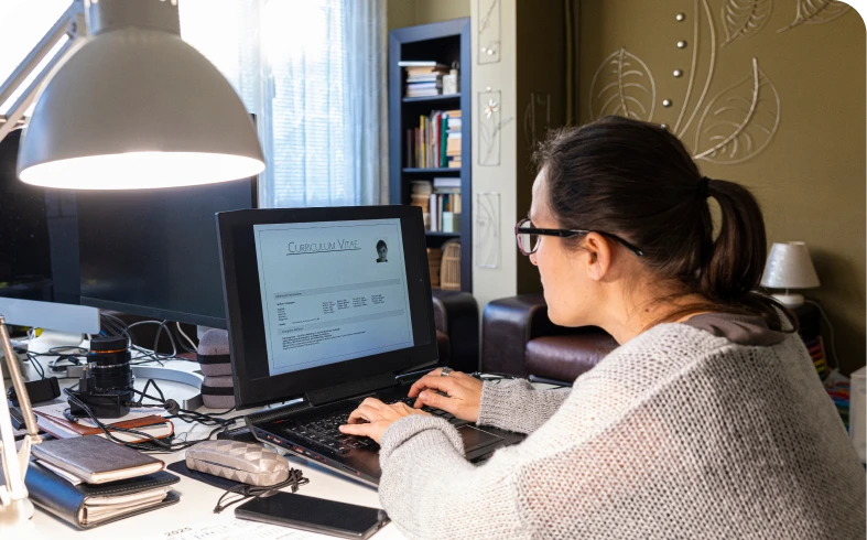 Woman working on computer at home office