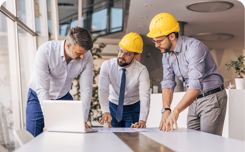 Engineers reviewing plans in an office