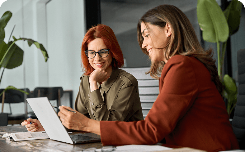 Colleagues smiling during a meeting