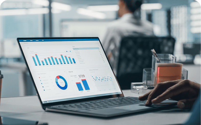 Laptop displaying financial charts and graphs