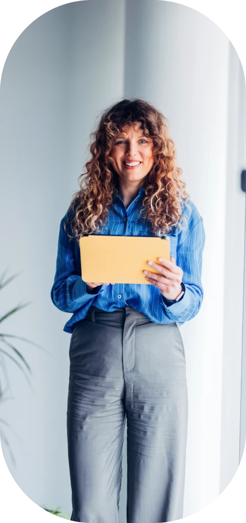 Individual standing with envelope in office
