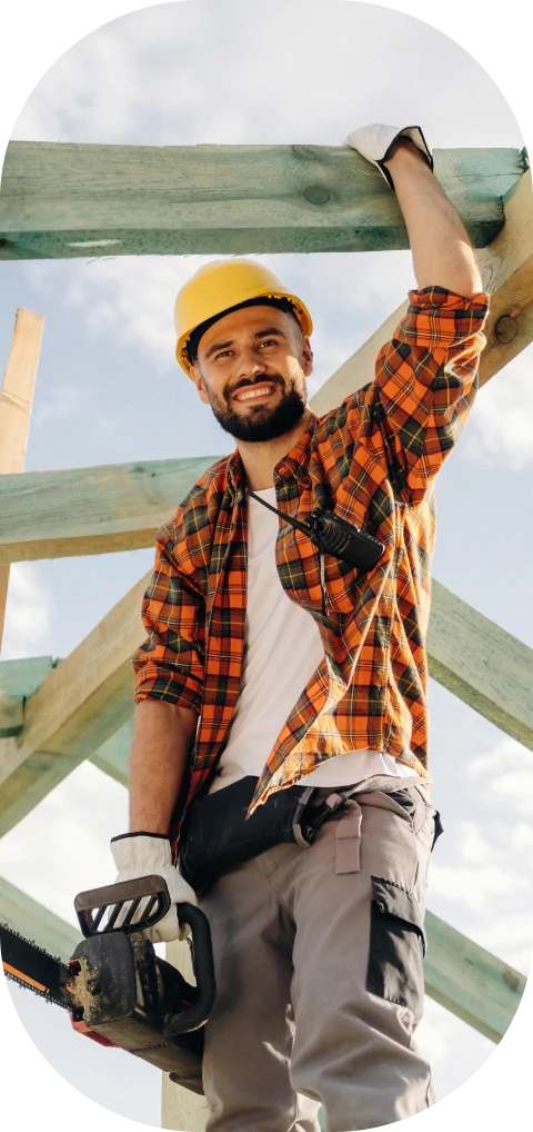 Builder in plaid shirt at construction site