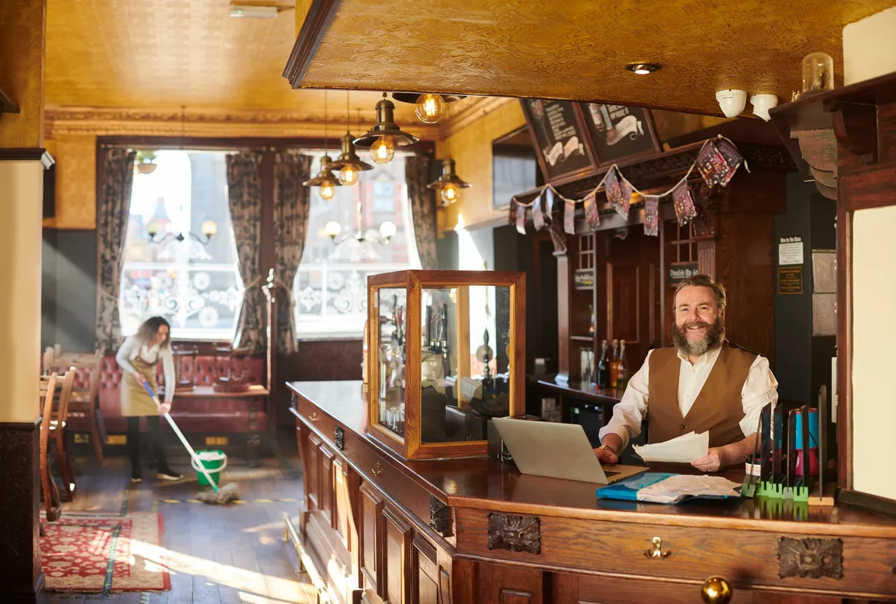 Bartender smiling in cozy pub
