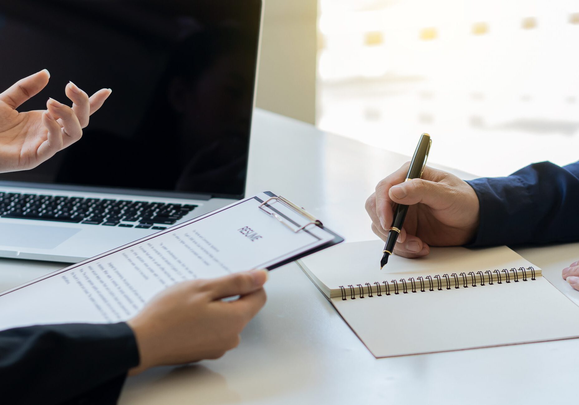 Employers check the resume of job applicants and interview them at work.