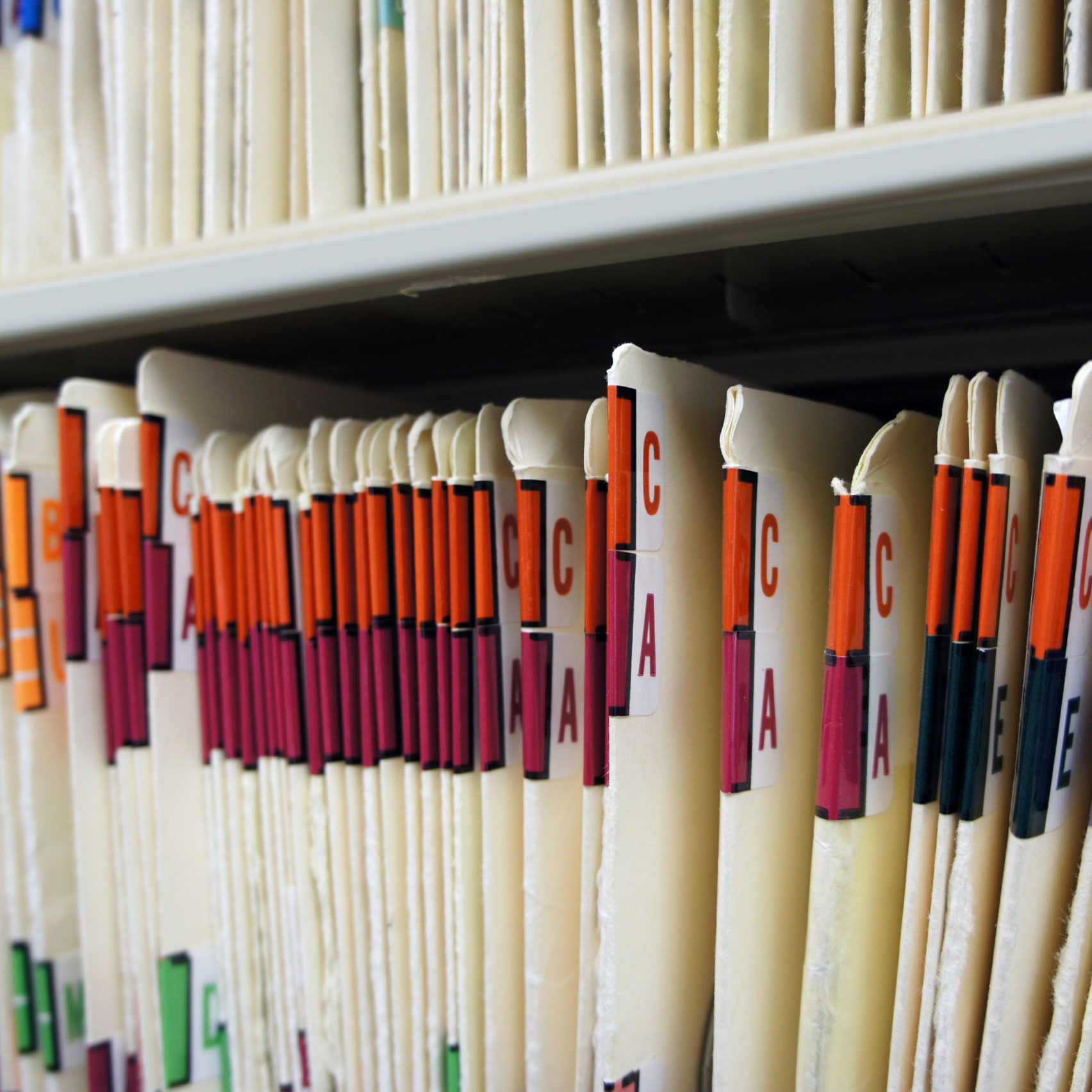 Medical records in file cabinet at doctor's office.